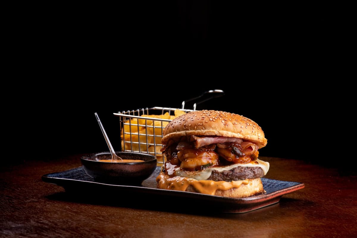 A Burger And Fries With Spicy Mayo.